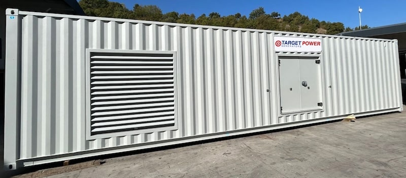 Image description: A containerized diesel generator manufactured by Target Power Generators UK, showcasing robust design and compact integration suitable for various power generation needs
