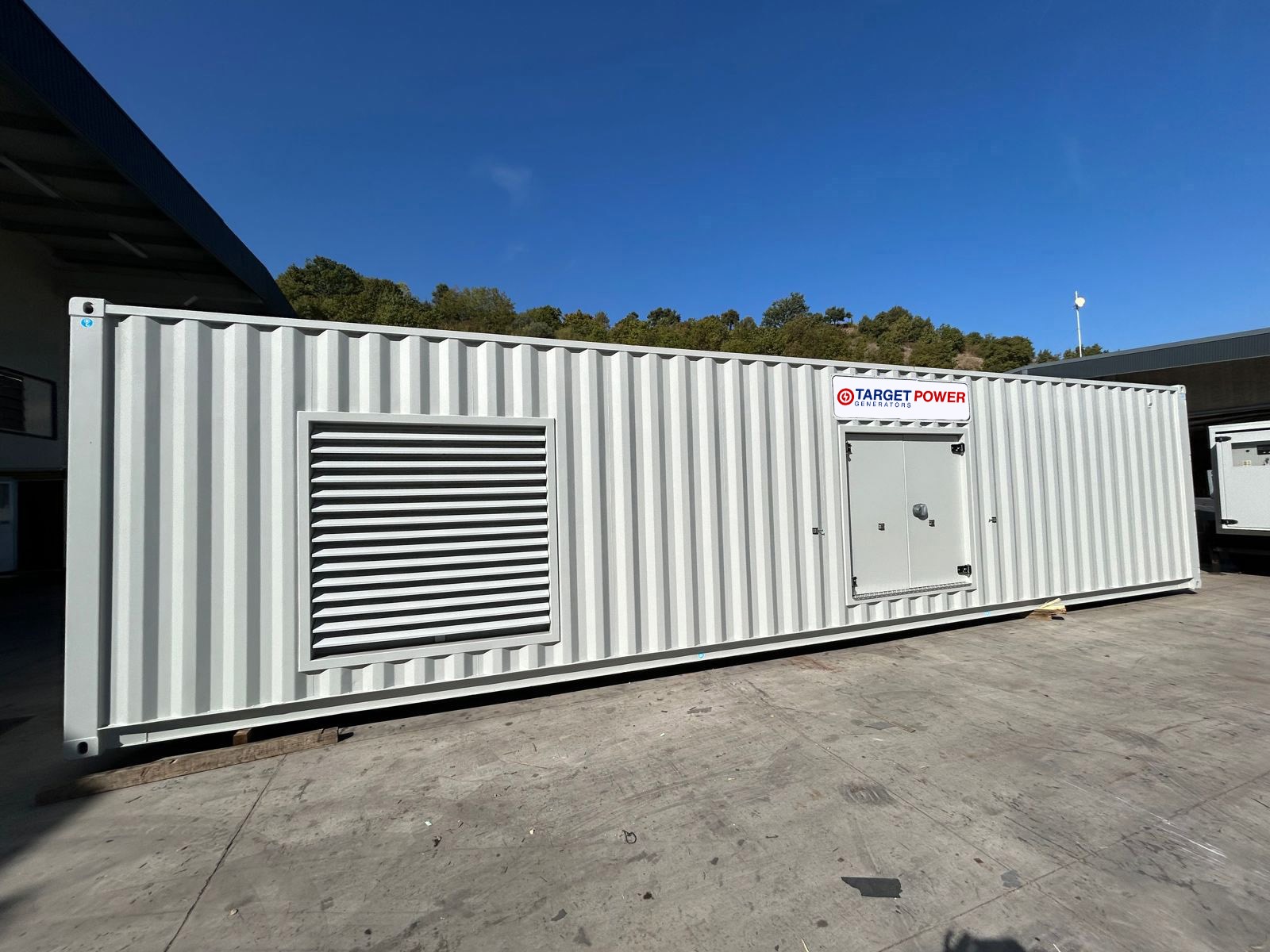 A containerized diesel generator by Target Power Generators UK, demonstrating their expertise in providing reliable power solutions in a compact and efficient package